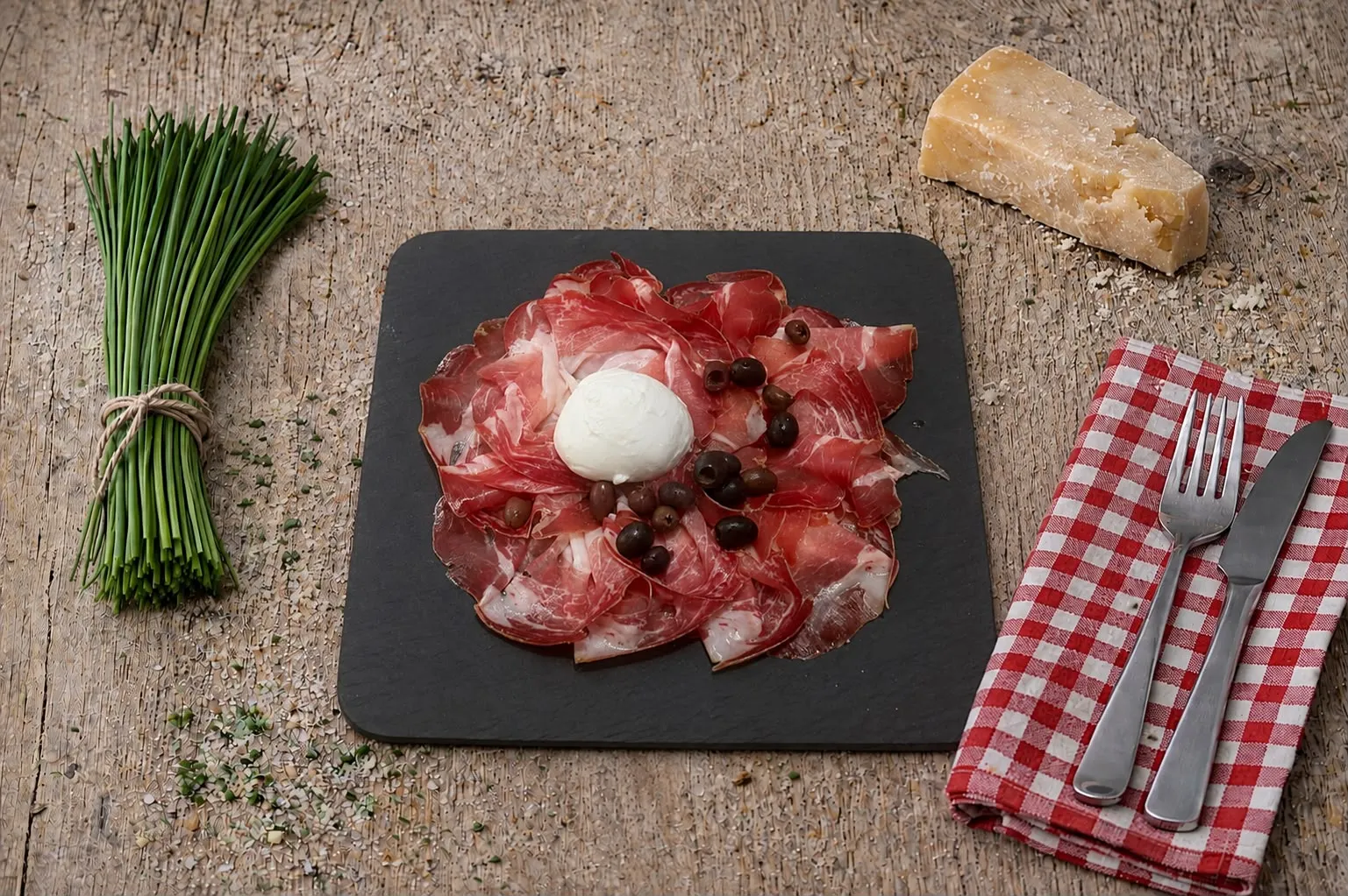 Cured ham platter with olives and buffalo mozzarella